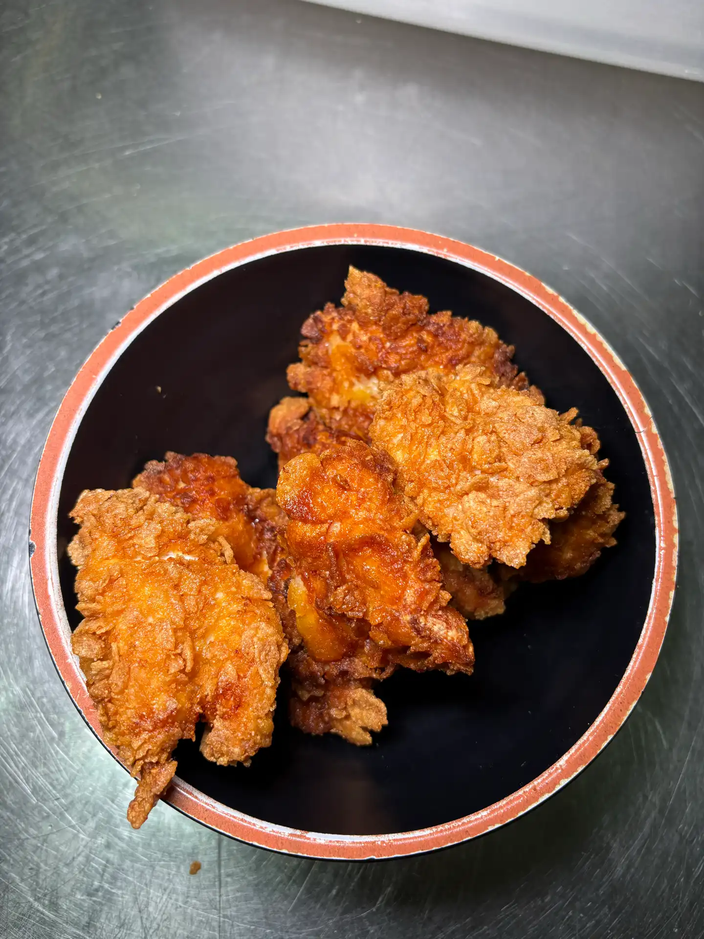 Nuggets di pollo impanati ai corn flakes
